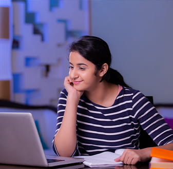 student sitting in front of laptop