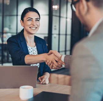 Hotel Management graduate shaking hands