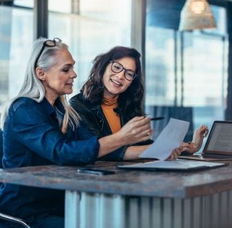 Female CEOs sitting at a desk