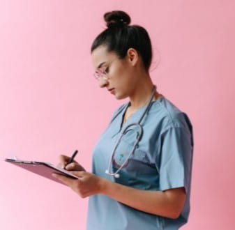 Female nurse taking notes