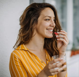 Woman taking a multivitamin