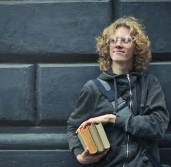 University student holding essentials