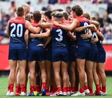 Melbourne Football Club team huddle