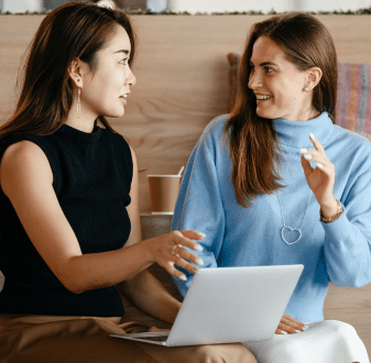 Two female international students chatting