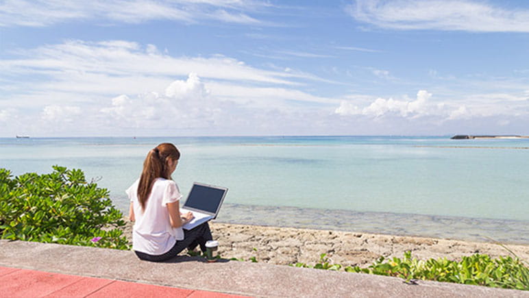 student-studying-at-beach