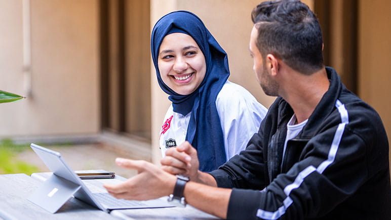 two-international-students-chatting
