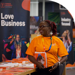 Torrens University Australia Events | Business Open Day | Staff smiling at booth