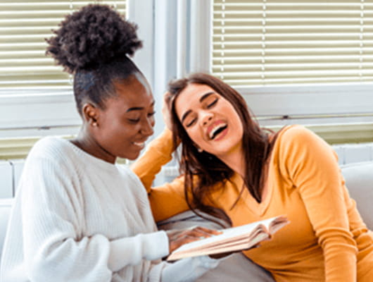 Two international students laughing