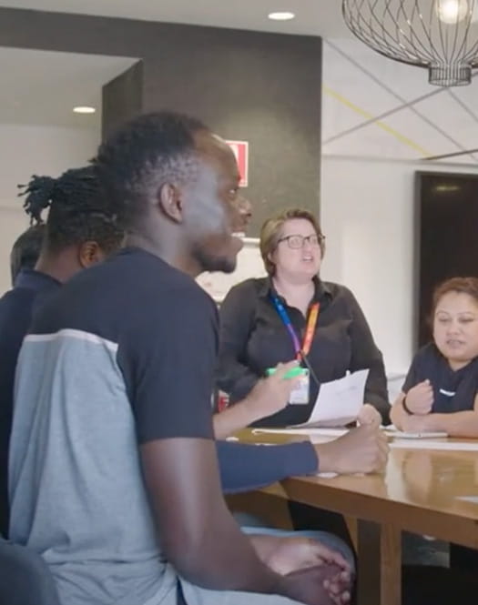 Students discussing social impact