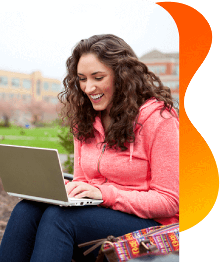 Study Pathways | Torrens University | Student sitting outside on laptop