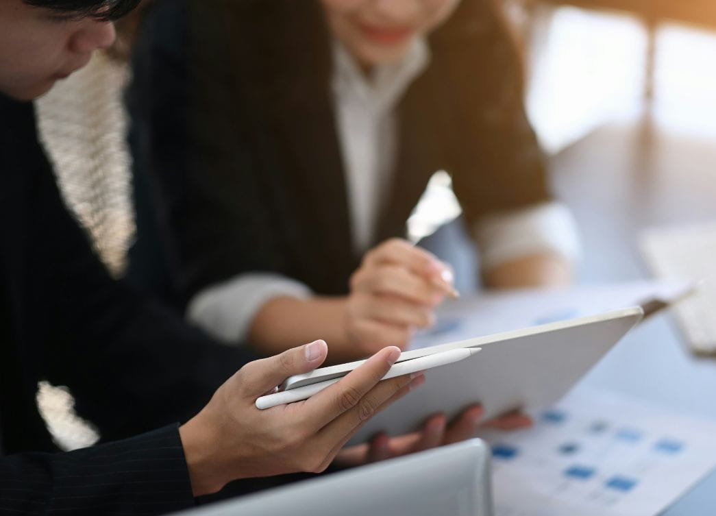 Business colleagues with tablet