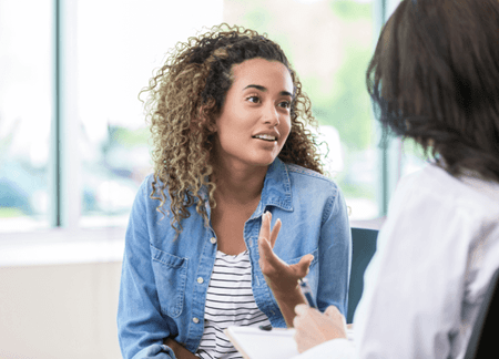Woman chatting with counselor 