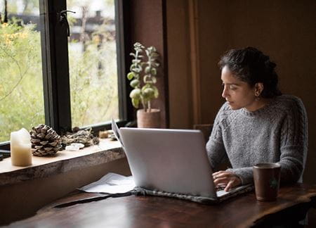 Certificate of Research | Female working on laptop | Torrens University Australia | Large