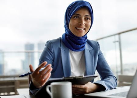 Professional Doctorate | Woman Holding Folder While In A Meeting | Torrens University | lg