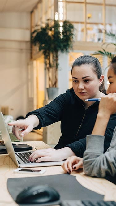 Higher Degree by Research | Torrens University Australia |Women Working Computer | Large