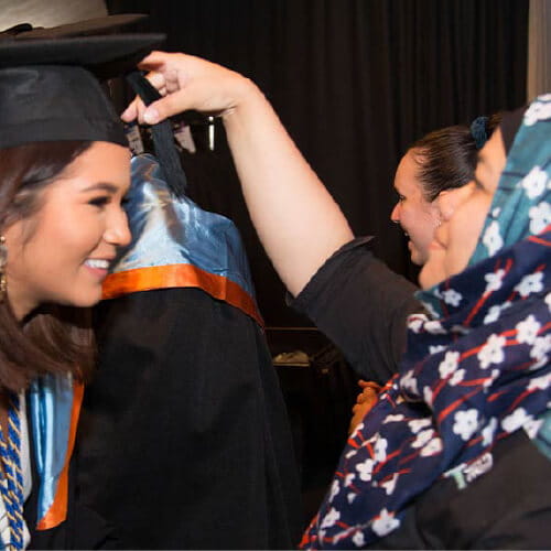 Torrens University graduate smiling