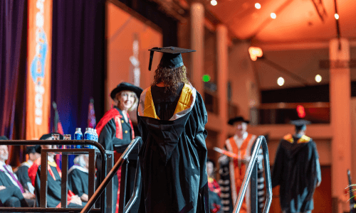 Graduation student on stage | Torrens University