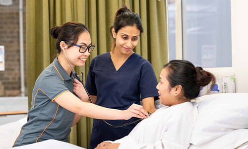 Nursing students in simulation room