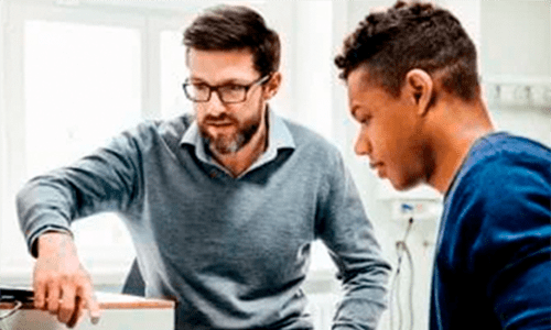 Learning facilitator helping student